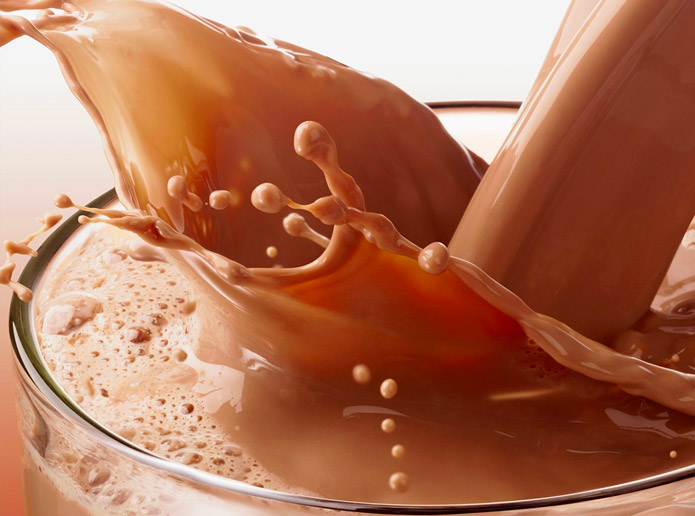 Chocolate milk pouring into glass